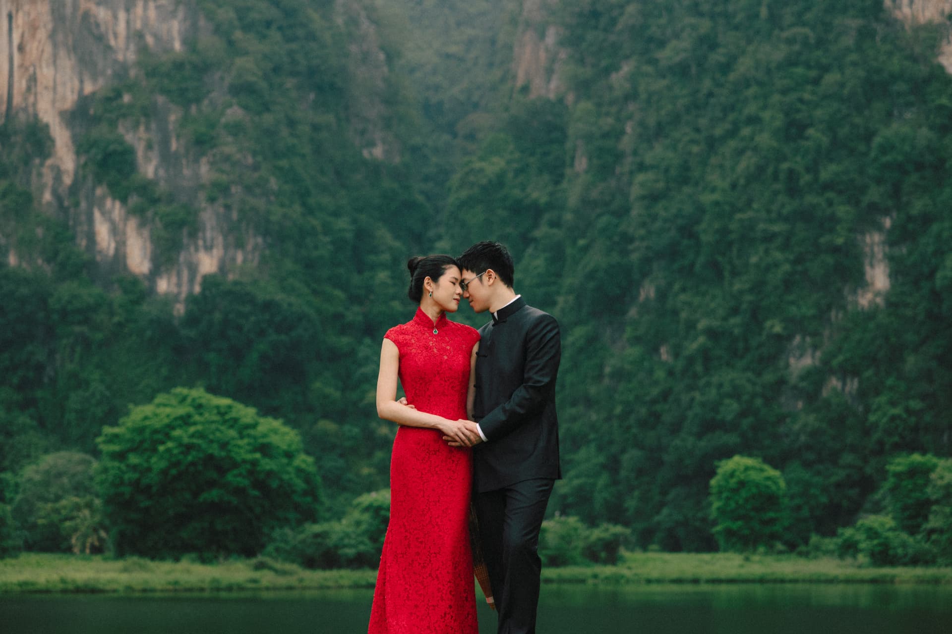 Wui Yan and Li Yen in traditional attire by a lake